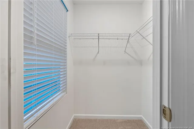 a bathroom with a shower and a shower curtain