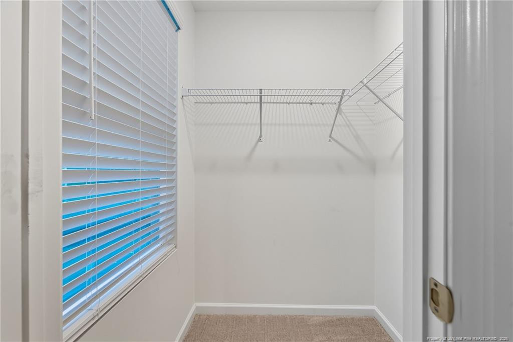 28 White Hart Court Angier, NC 27501 - Photo 27 of 36 a bathroom with a shower and a shower curtain