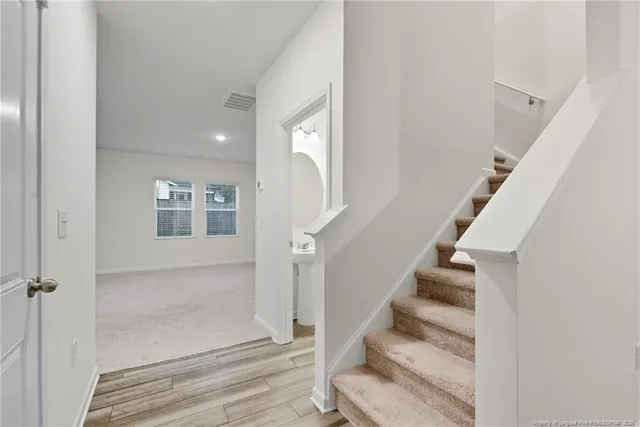 a kitchen with stainless steel appliances kitchen island granite countertop a sink and cabinets