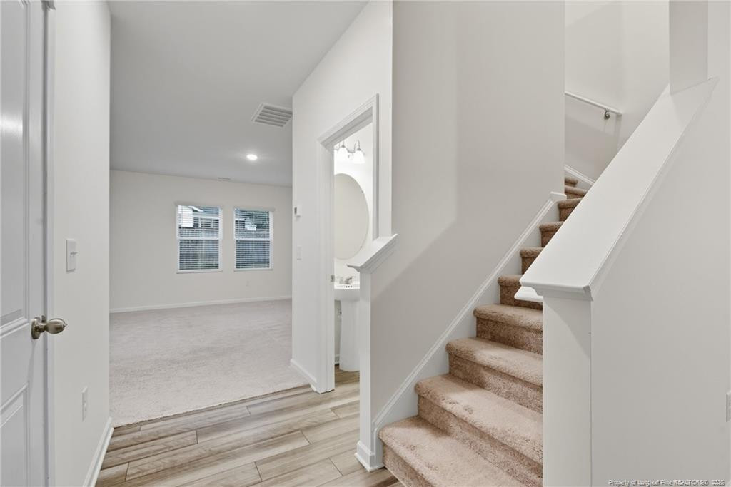 28 White Hart Court Angier, NC 27501 - Photo 7 of 36 a view of entryway and hall with wooden floor