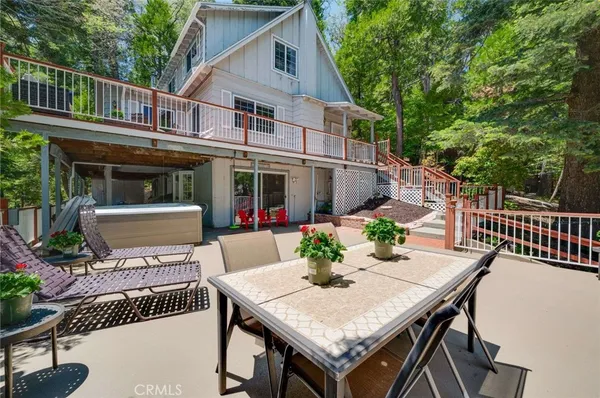 a view of a patio with table and chairs