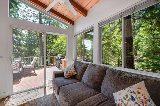 a living room with couch and a large window