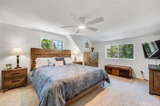 a bedroom with a bed and a fireplace