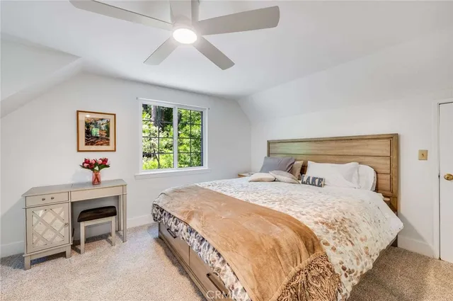 a bedroom with a bed and a fireplace