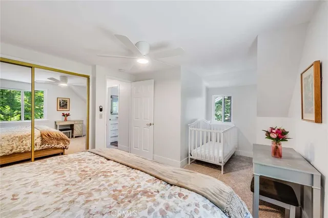 a bedroom with a bed and a couch