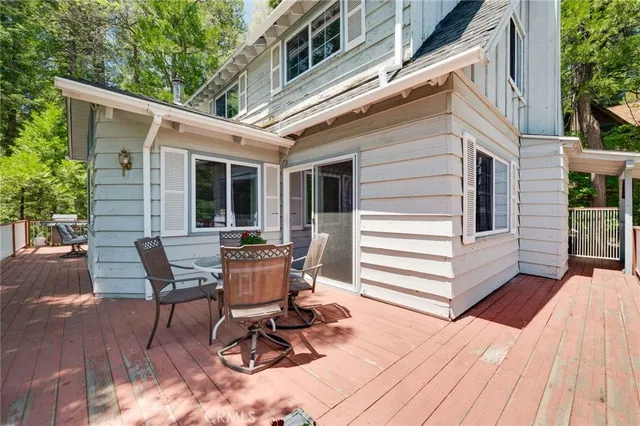 a view of a patio with a table and chairs