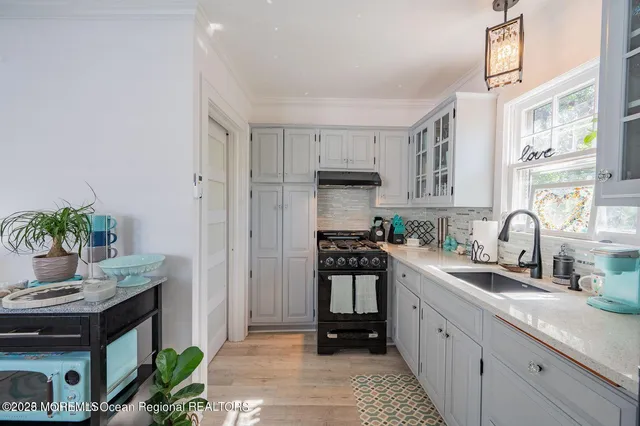 a kitchen with cabinets and appliances