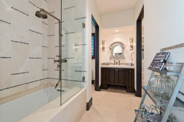 a spacious bedroom with a bathtub and a window