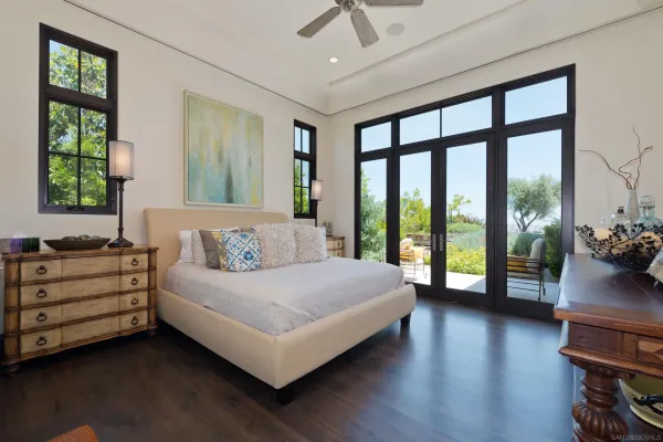 a bedroom that has a bed and a table in it
