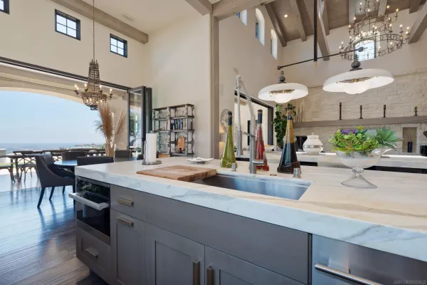 a kitchen with a table and chairs in it