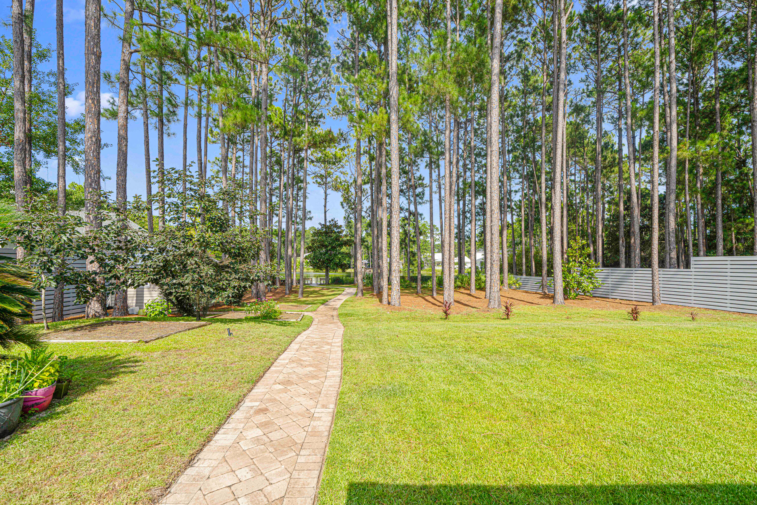 216 Santa Barbara Avenue Santa Rosa Beach, FL 32459 - Photo 17 of 85 a swimming pool with outdoor seating and yard