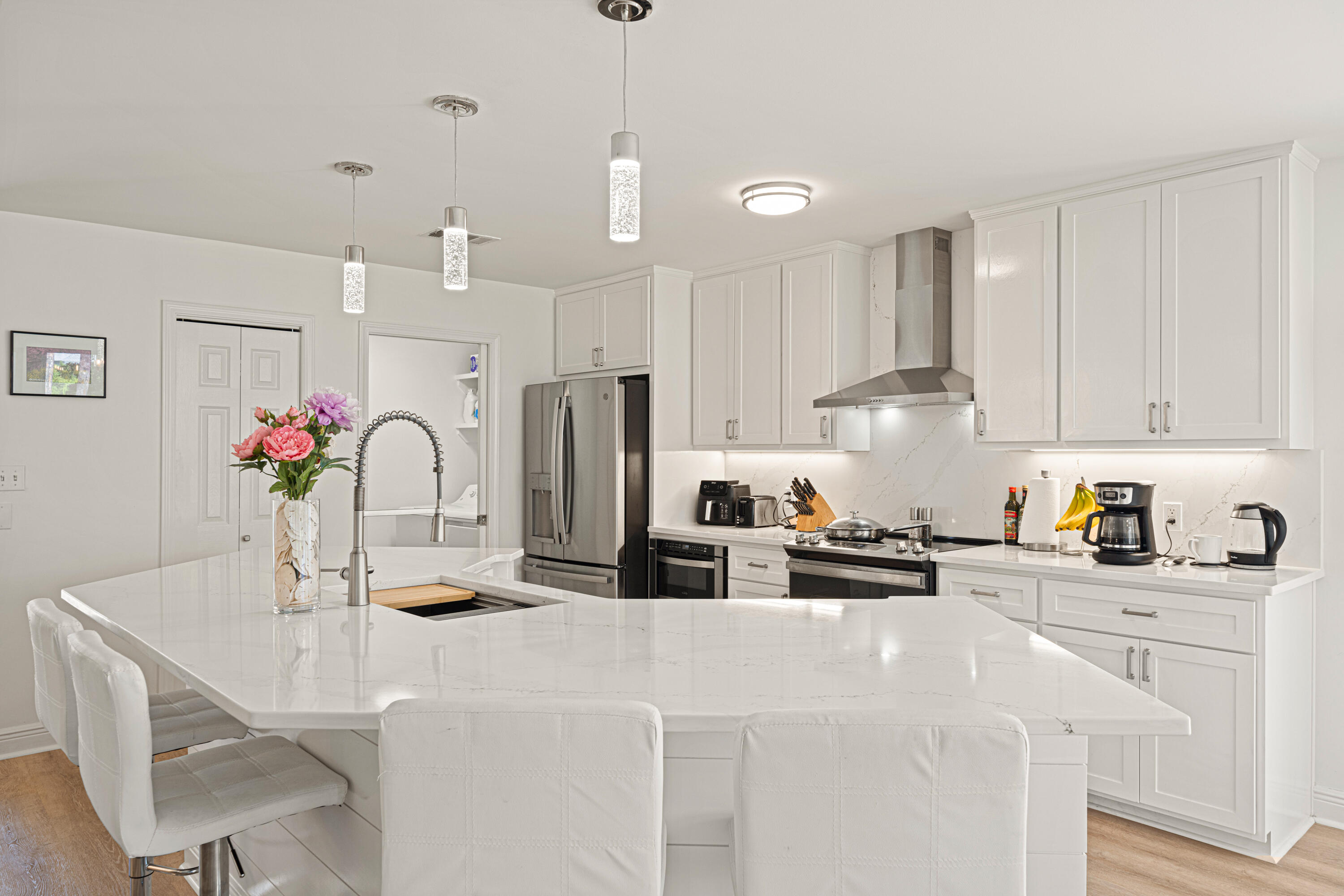 216 Santa Barbara Avenue Santa Rosa Beach, FL 32459 - Photo 26 of 85 a kitchen with stainless steel appliances kitchen island granite countertop a sink and cabinets