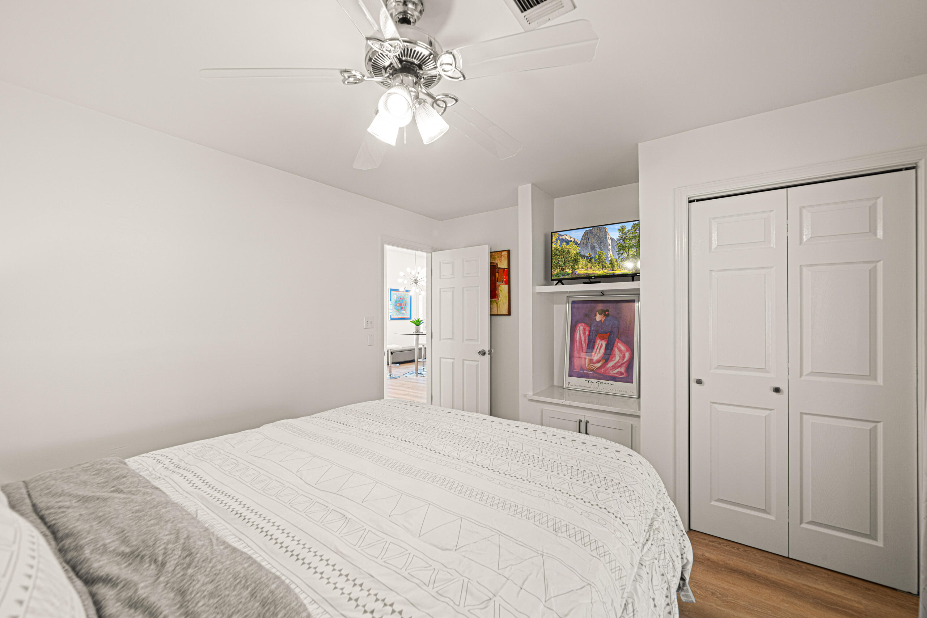 216 Santa Barbara Avenue Santa Rosa Beach, FL 32459 - Photo 38 of 85 a bedroom with a bed and a chandelier