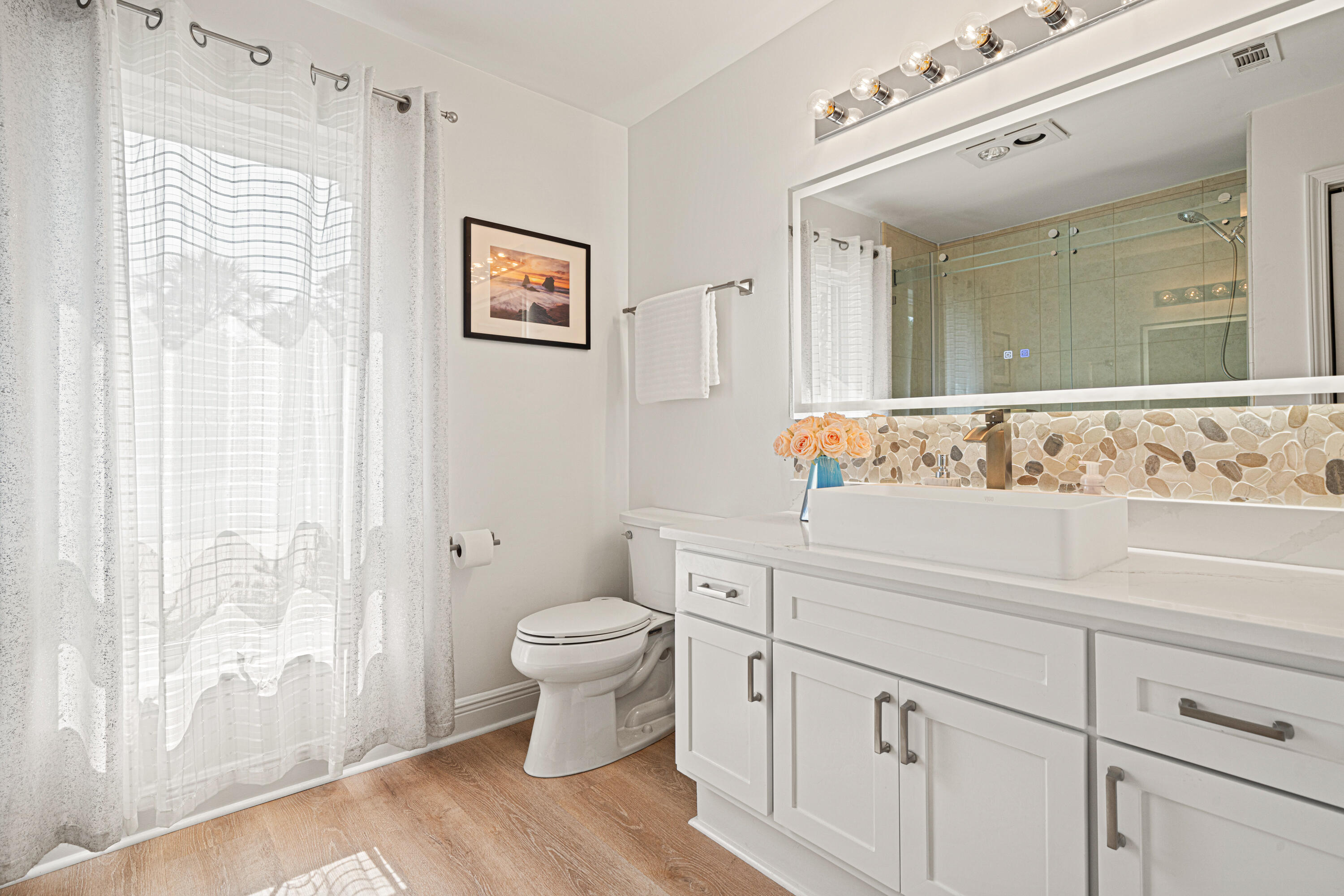 216 Santa Barbara Avenue Santa Rosa Beach, FL 32459 - Photo 39 of 85 a bathroom with a sink a toilet and a mirror