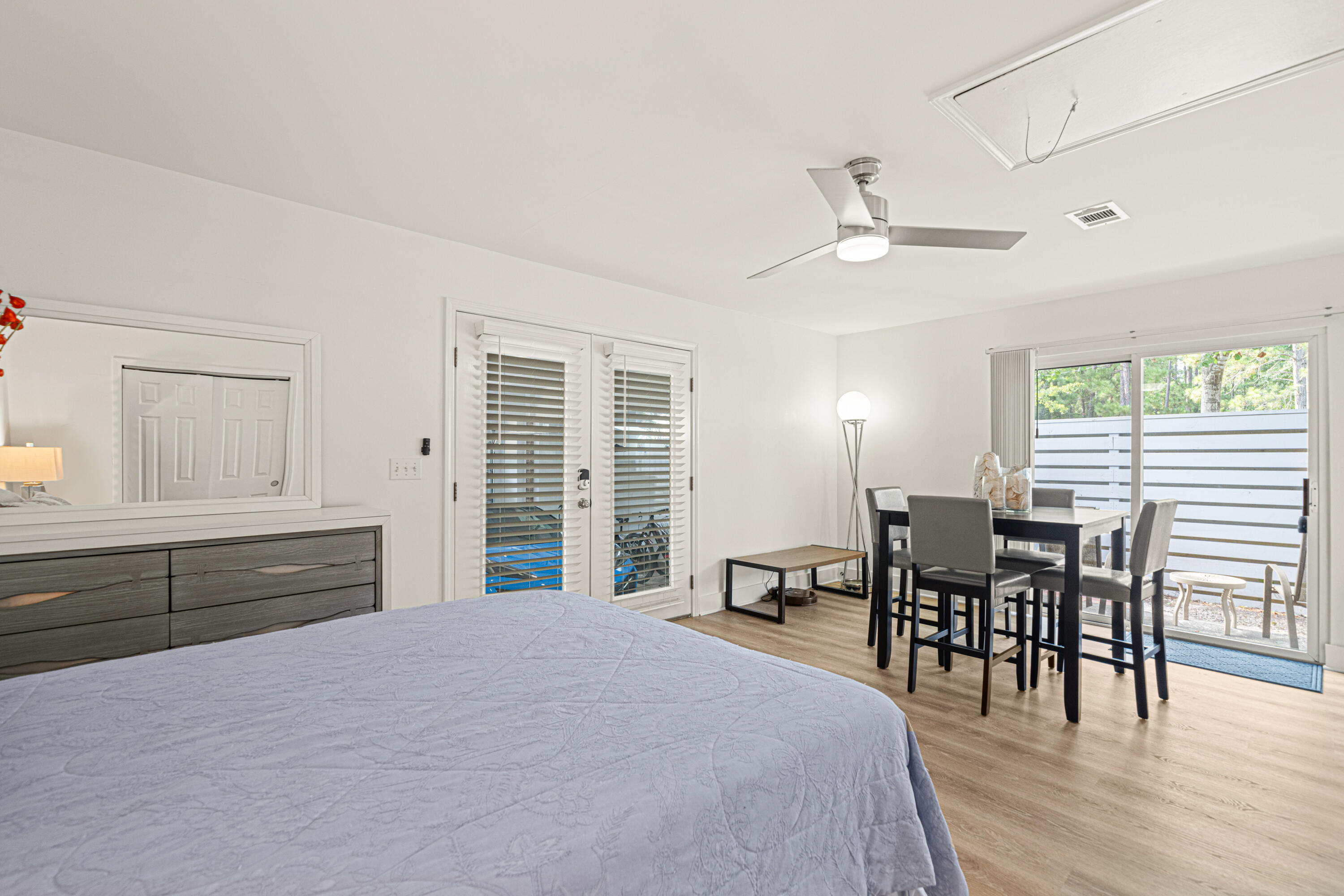 216 Santa Barbara Avenue Santa Rosa Beach, FL 32459 - Photo 61 of 85 a bedroom with furniture and large windows