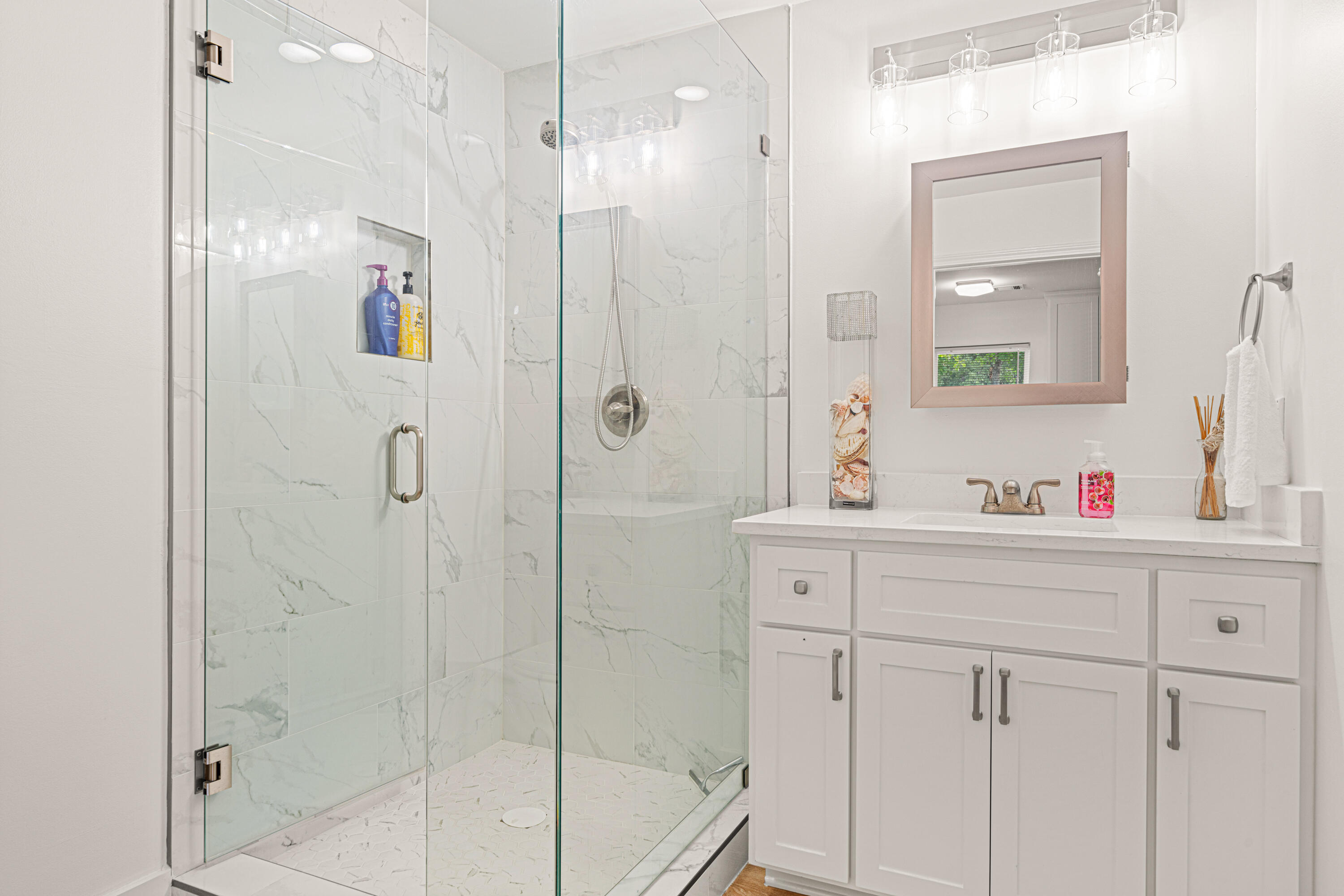 216 Santa Barbara Avenue Santa Rosa Beach, FL 32459 - Photo 65 of 85 a bathroom with a shower sink and mirror