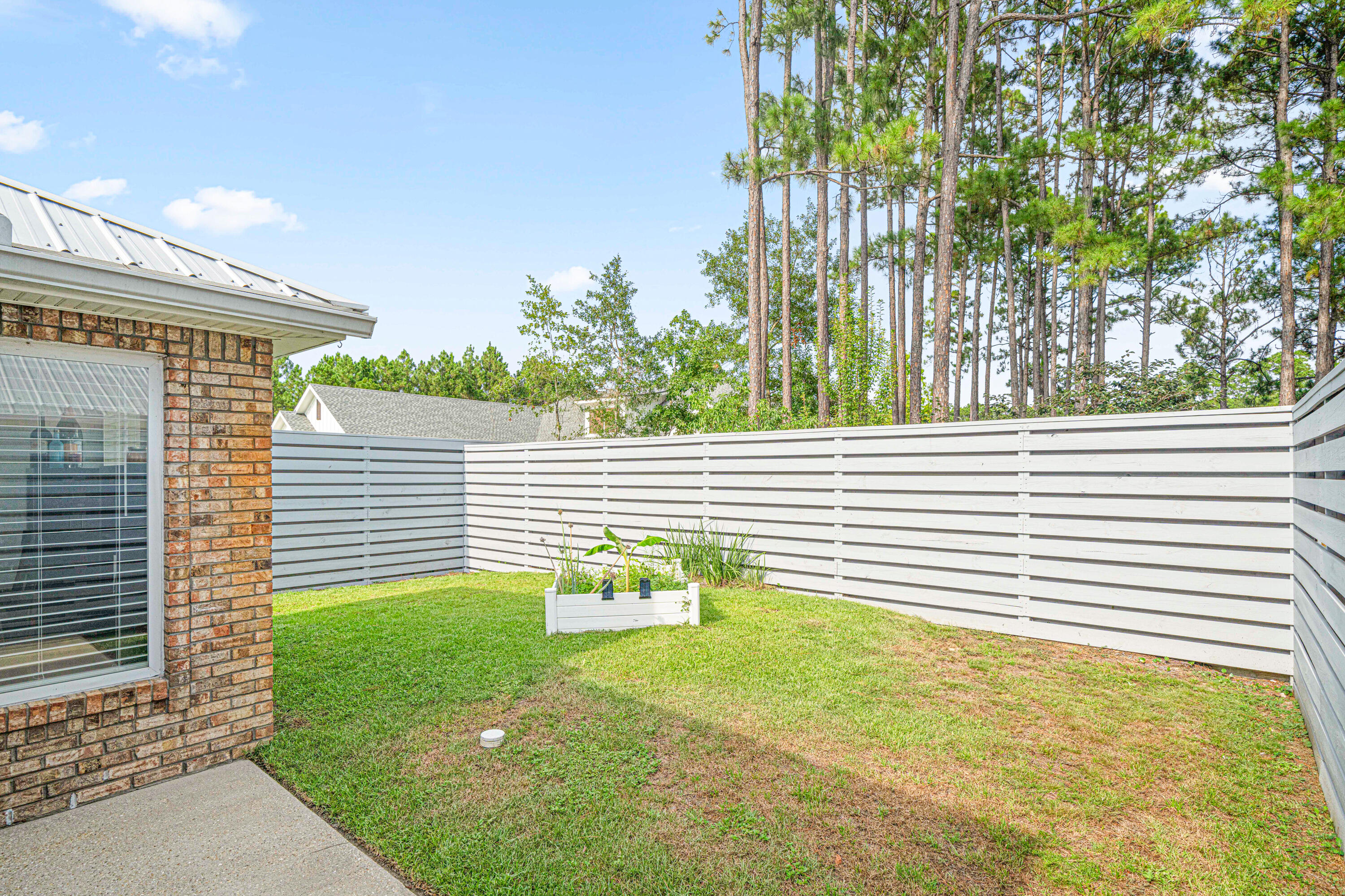 216 Santa Barbara Avenue Santa Rosa Beach, FL 32459 - Photo 69 of 85 a view of a porch with a backyard