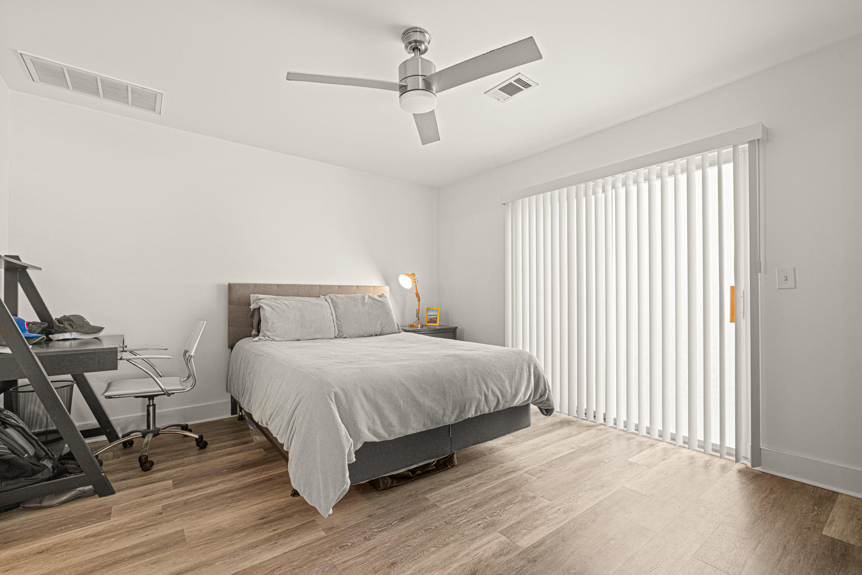 216 Santa Barbara Avenue Santa Rosa Beach, FL 32459 - Photo 75 of 85 a spacious bedroom with a bed and a ceiling fan