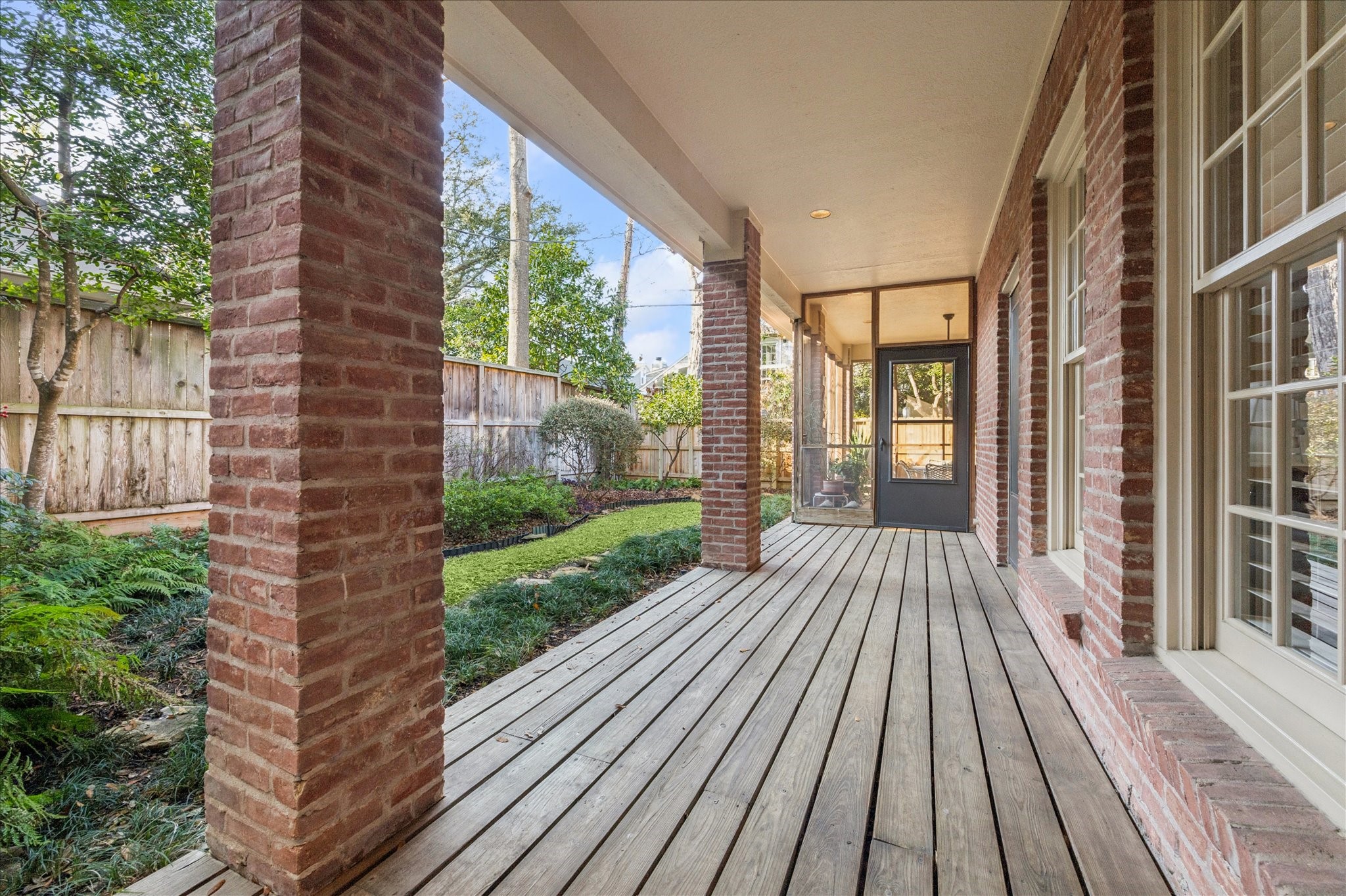 5614 Mercer Street Houston, TX 77005 - Photo 18 of 20 Covered porch looking back to the screened in porch