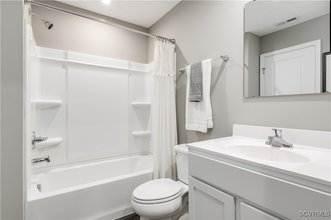 1248 Canterbury Ridge Road Richmond, VA 23224 - Photo 12 of 13 a bathroom with a sink toilet and shower