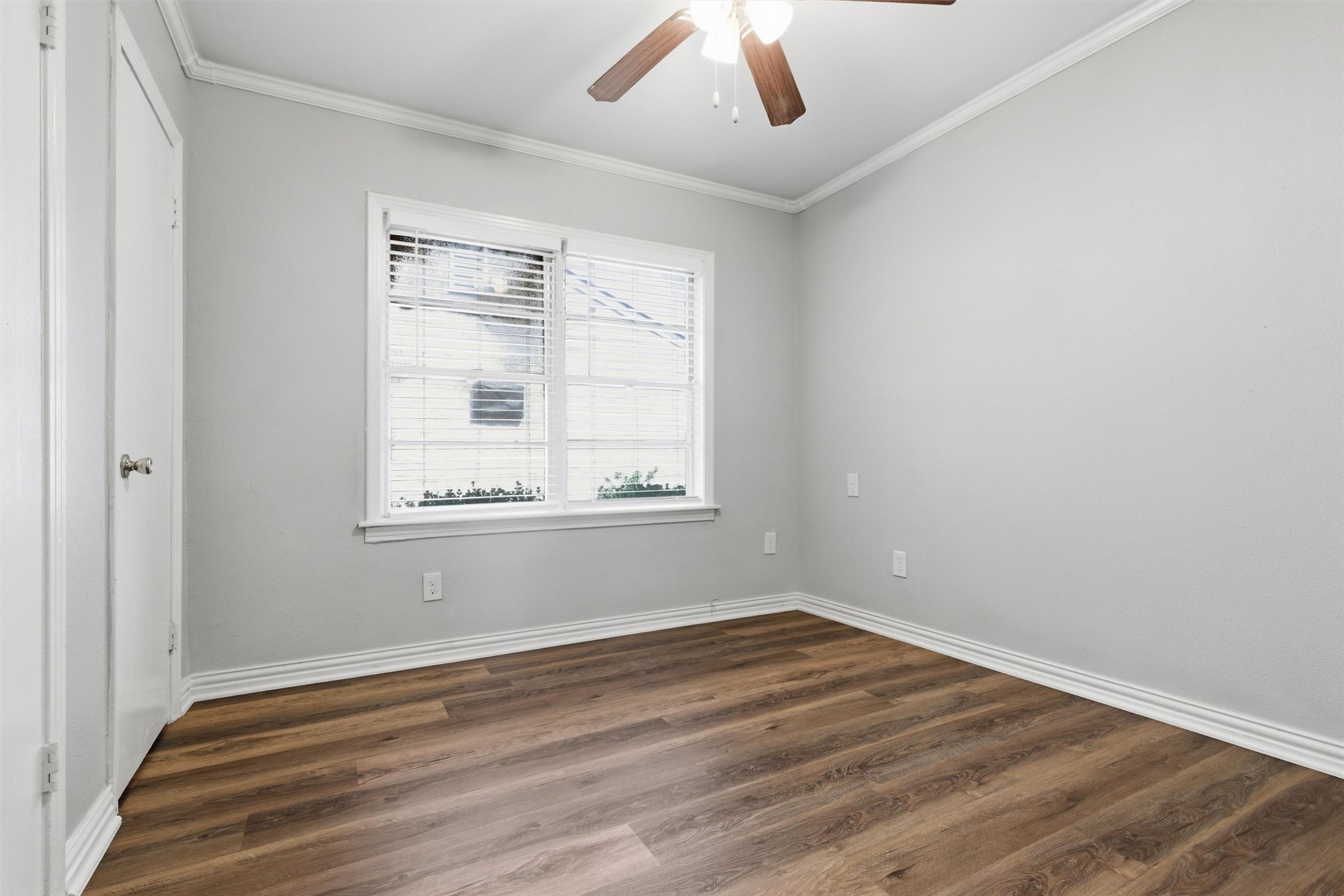 3615 Alberta Street Houston, TX 77021 - Photo 12 of 16 wooden floor in an empty room with a window