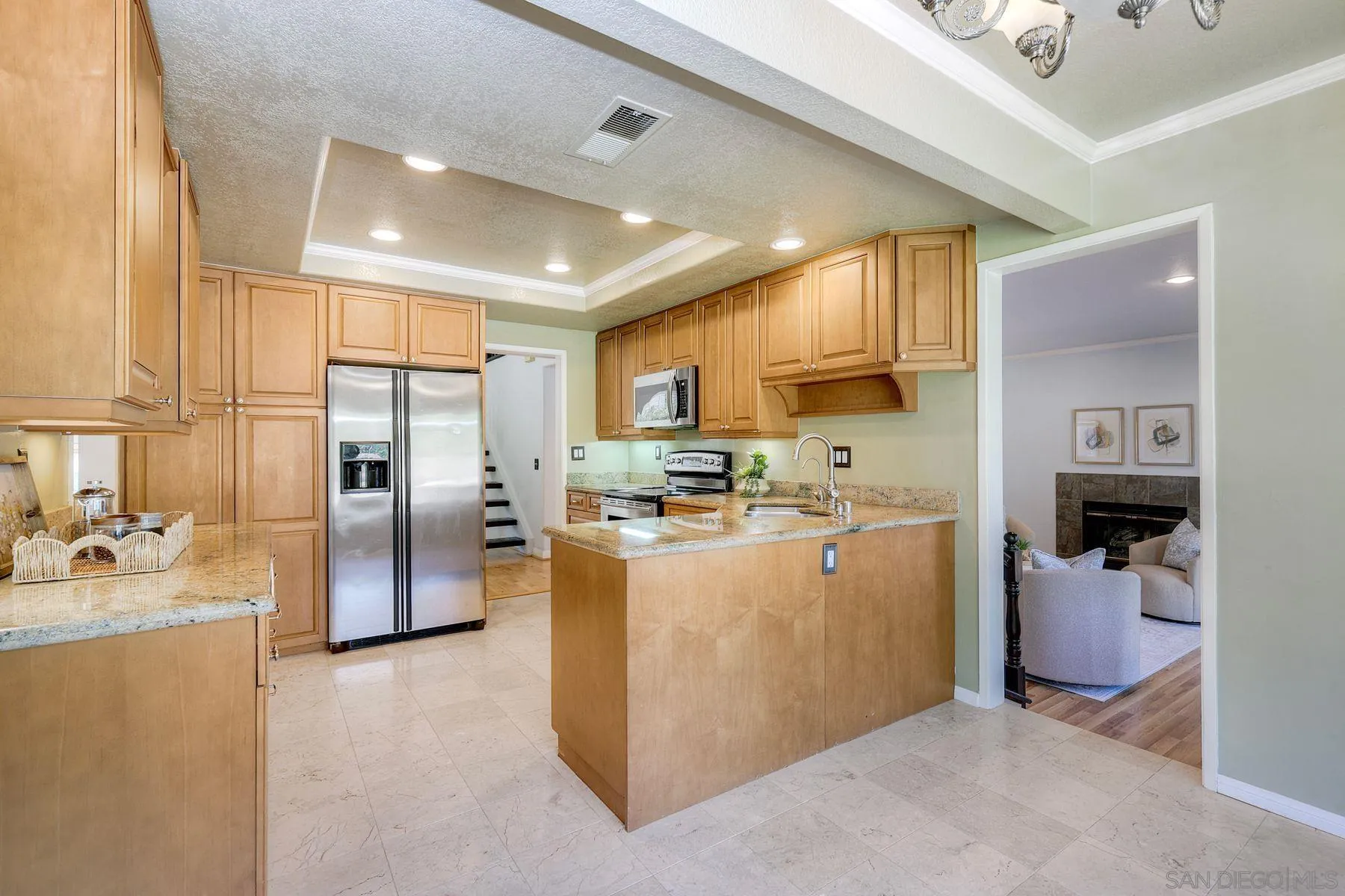 13976 Country Creek Road Poway, CA 92064 - Photo 11 of 40 a open kitchen with stainless steel appliances granite countertop a refrigerator stove top oven and sink