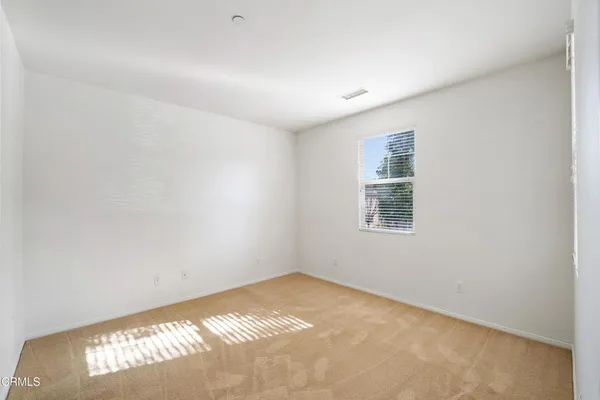 a view of empty room with windows