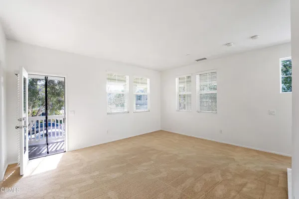 a view of a kitchen with a sink and a window