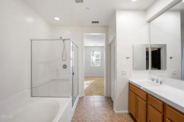 a bathroom with a shower and a tub