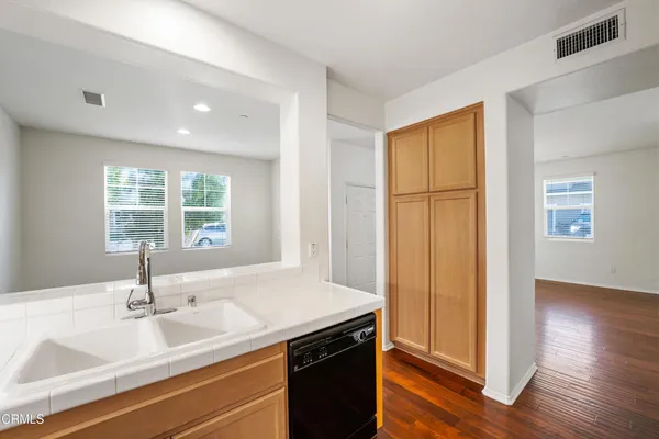 a view of kitchen and wooden floor