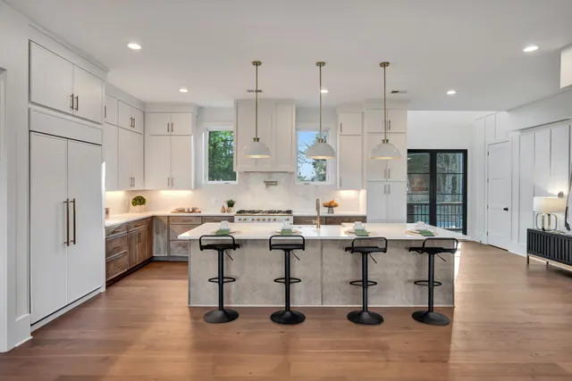 a view of a livingroom with furniture window and wooden floor