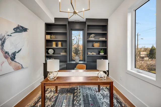 a view of an entryway with wooden floor and a rug