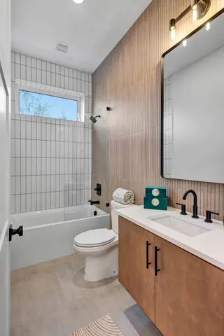 a view of empty room with wooden floor and entryway