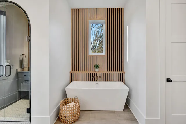 a hallway with a dresser and a window