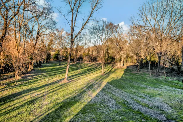 an empty room with windows and mountain view