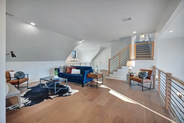 a view of a big house with a big yard and large trees