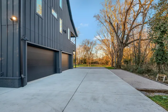 a kitchen with stainless steel appliances a white stove top oven and cabinets