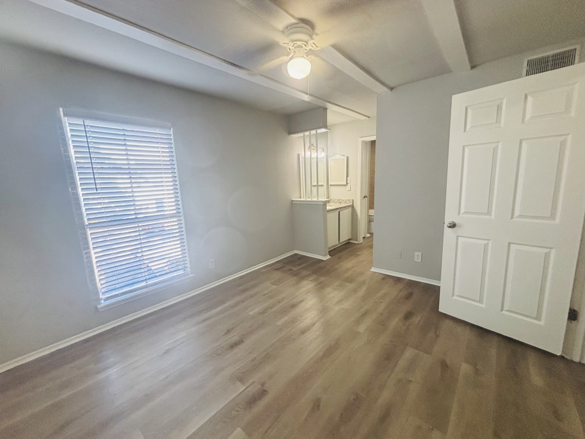 6200 West Tidwell Road, Unit 1109 Houston, TX 77092 - Photo 15 of 18 a view of empty room with wooden floor and fan
