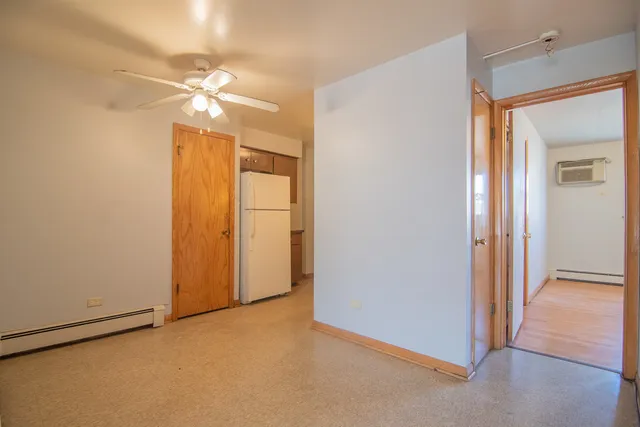 a view of a room with a fan and a fan
