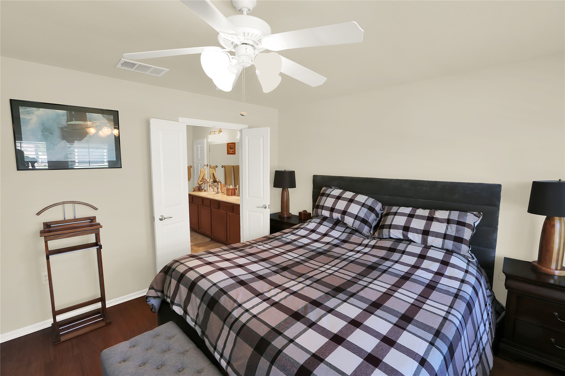 104 Sheldon Lake Drive Georgetown, TX 78633 - Photo 13 of 40 a bedroom with a large bed and a tv