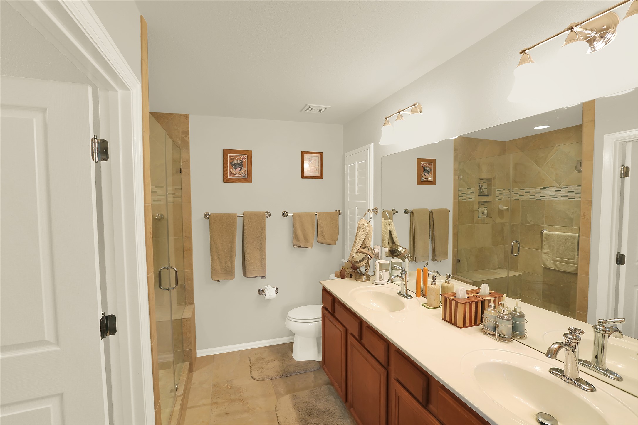 104 Sheldon Lake Drive Georgetown, TX 78633 - Photo 15 of 40 a bathroom with a double vanity sink mirror double shower and a bathtub