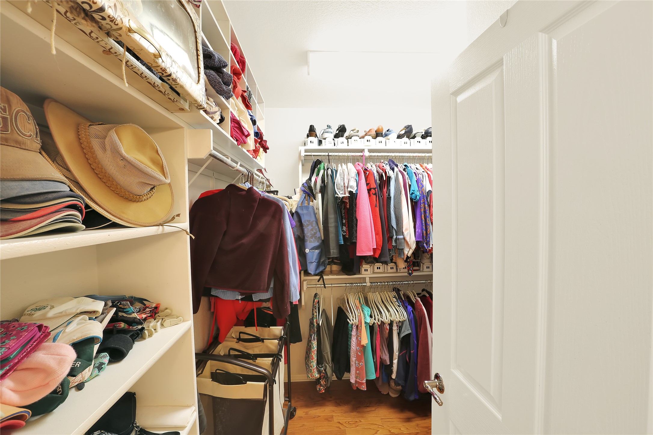 104 Sheldon Lake Drive Georgetown, TX 78633 - Photo 16 of 40 a view of walk in closet with clothes and shoes