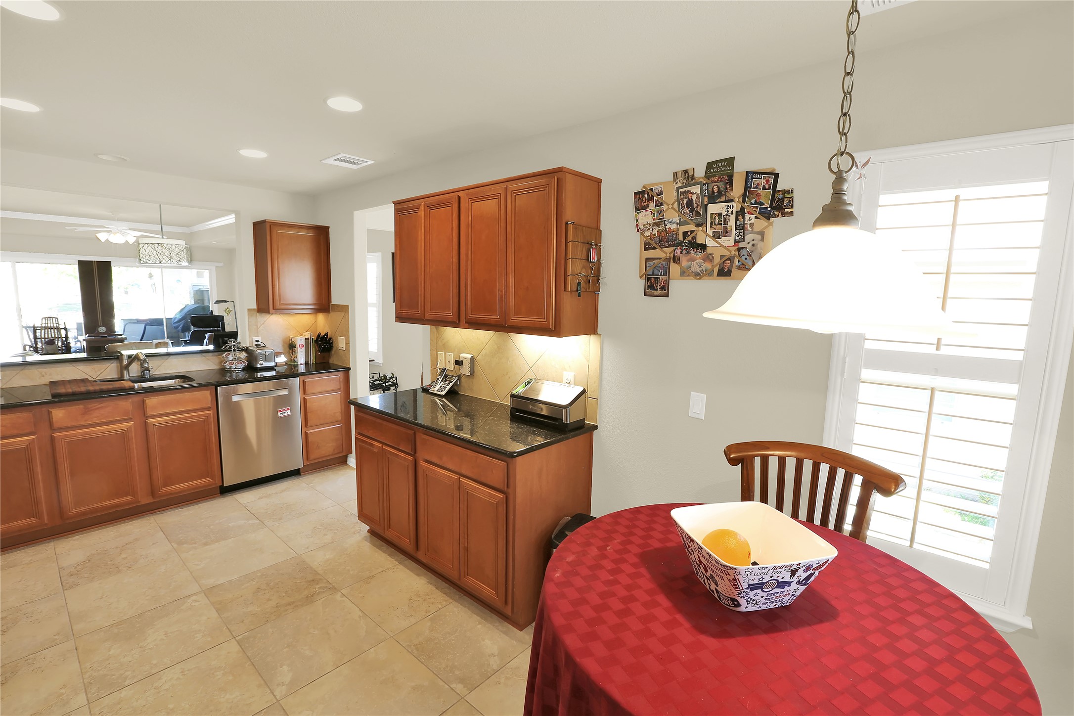 104 Sheldon Lake Drive Georgetown, TX 78633 - Photo 5 of 40 a kitchen with stainless steel appliances granite countertop a stove top oven a sink a dining table and chairs