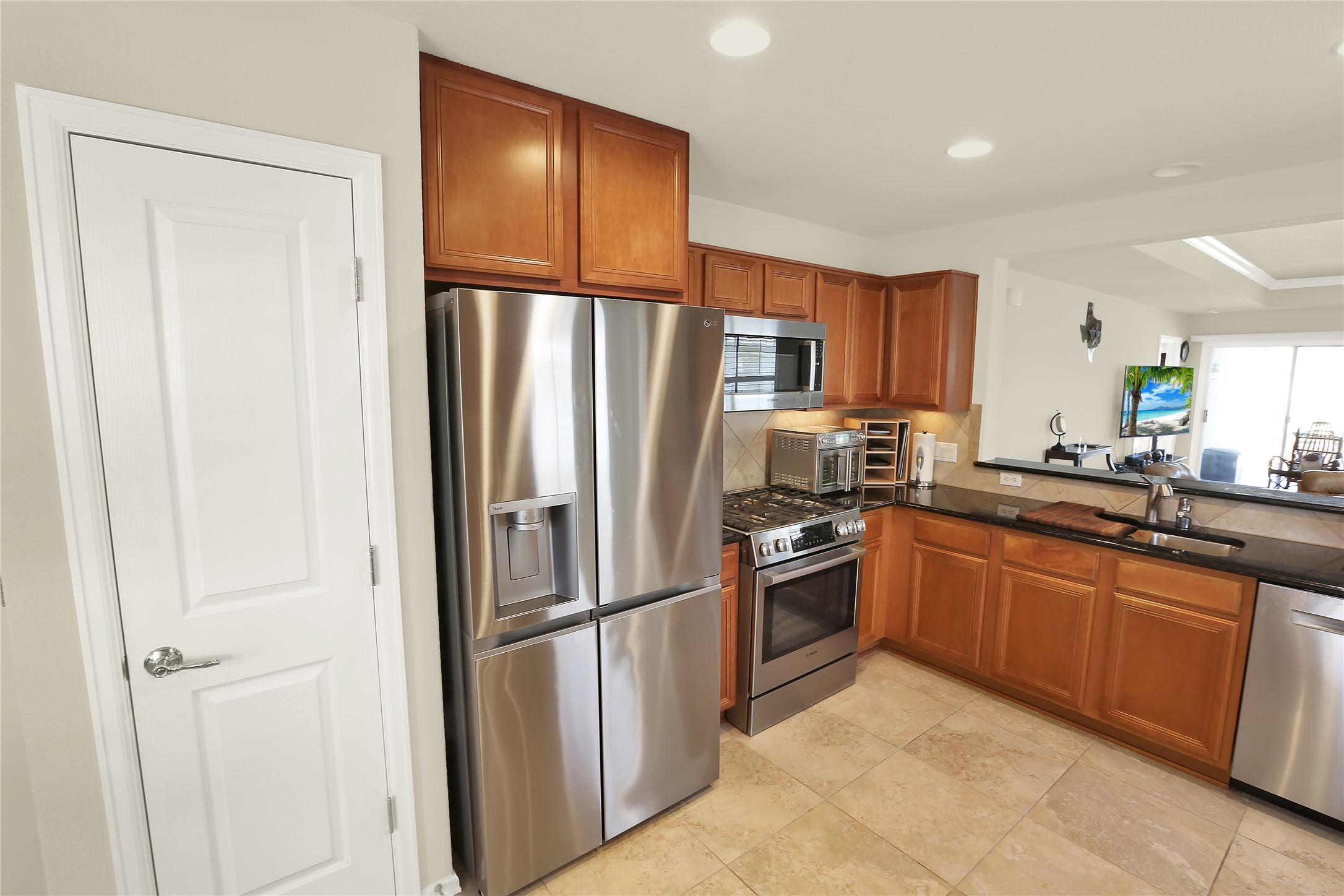 104 Sheldon Lake Drive Georgetown, TX 78633 - Photo 6 of 40 a kitchen with stainless steel appliances granite countertop a refrigerator sink and cabinets