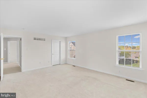 an empty room with windows