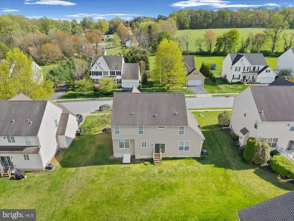 an aerial view of a house with a garden