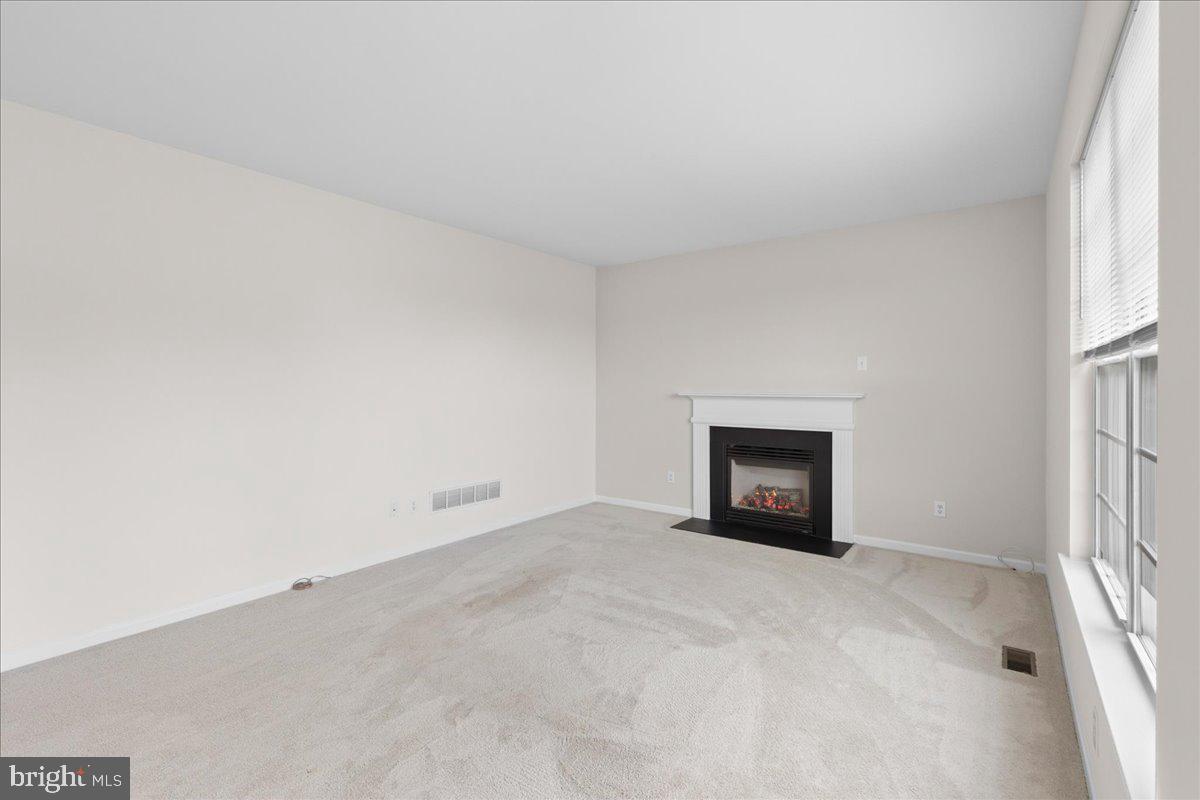 1437 Balmoral Road Coatesville, PA 19320 - Photo 31 of 52 Cozy space with a charming fireplace.