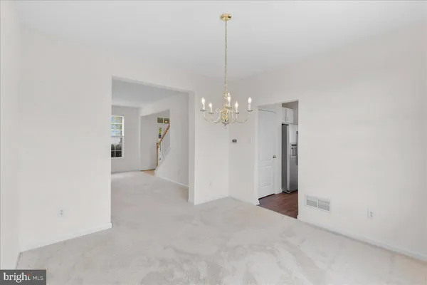 a view of a hallway with staircase