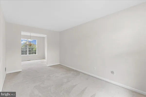 a black and white photo of a living room