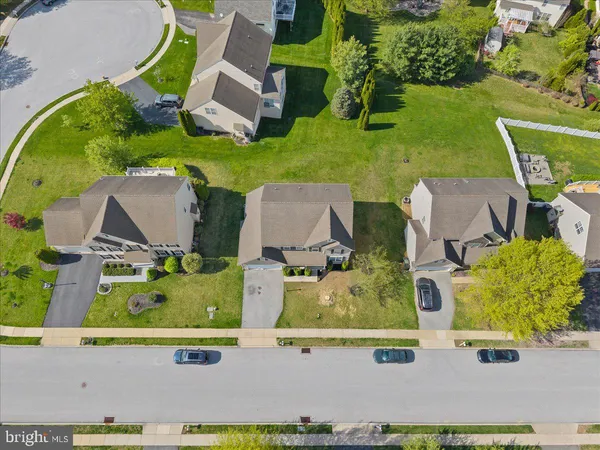 an aerial view of house with yard swimming pool and outdoor seating